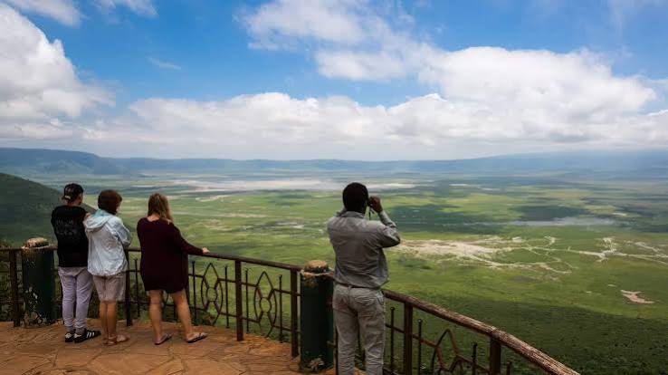 Visitors looking out over Ngorongoro Crater from a viewpoint