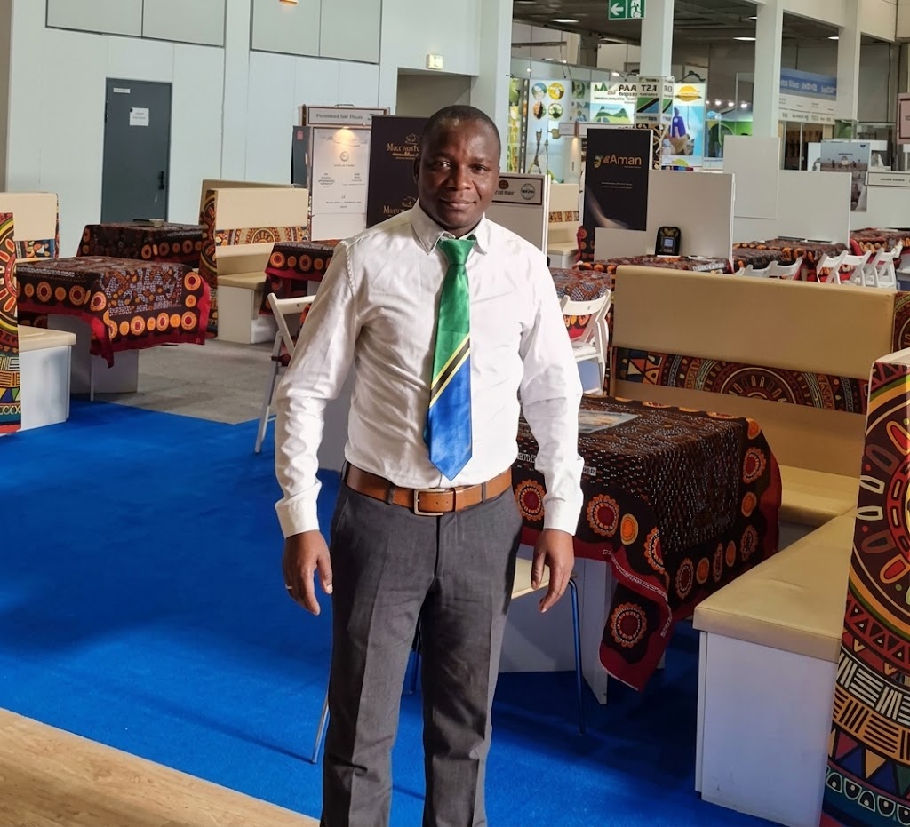 Mr. Venant Mafedha Dionise, owner of Tanzania World Link, at a Tanzania exhibition stand