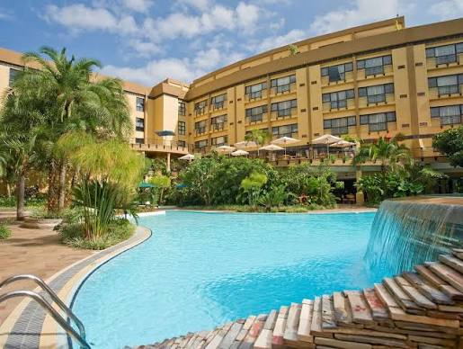 Tropical hotel resort with swimming pool and gardens