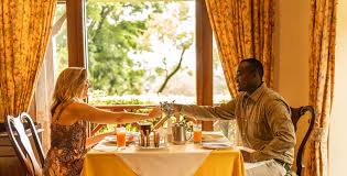 Couple toasting at a hotel restaurant table