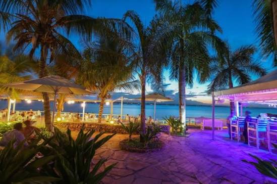 Waterfront hotel garden and evening dining area